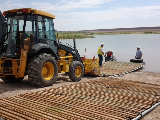 crew installs the temporary boat ramp at the Corps' South boat ramp