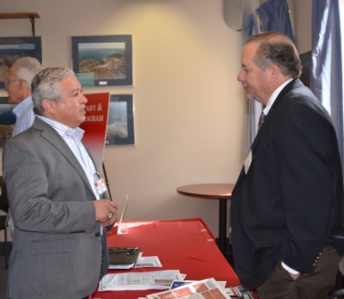Kris Schafer, chief of the District’s Planning Branch, speaks with a small business representative Feb. 26, 2015.