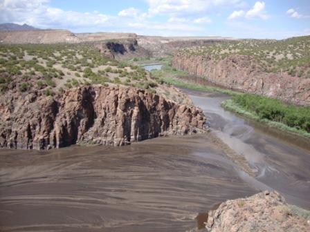 Ash and debris flow downstream during flooding