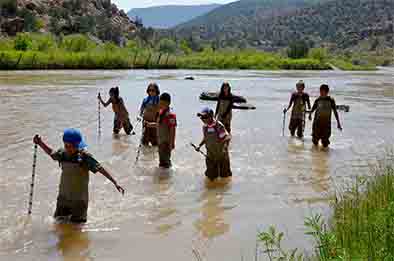 The students familiarized themselves with walking in the river in waders, Sept. 6, 2017.