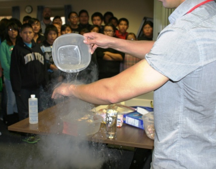 Chemist Andrew Trainor poured liquid nitrogen, which is very cold, on his arm demonstrating how it boils off right before it hits warmer objects. 