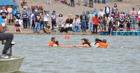 A canoe sinks just before reaching the finish line